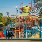 Multilevel interactive play structure with a giant tipping bucket!