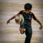 Child playing with football (Sarawak, Malaysia)