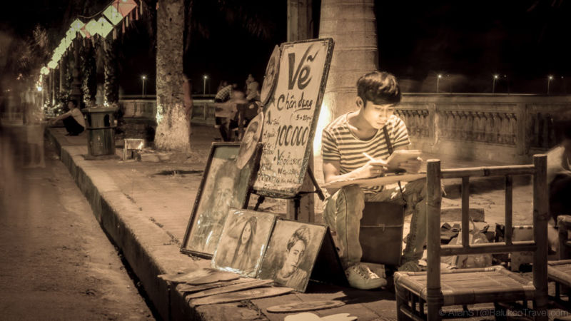 Engrossed artist at Hue Walking Street (Night Market). Hue, Central Vietnam. (Best of Central Vietnam Itinerary)
