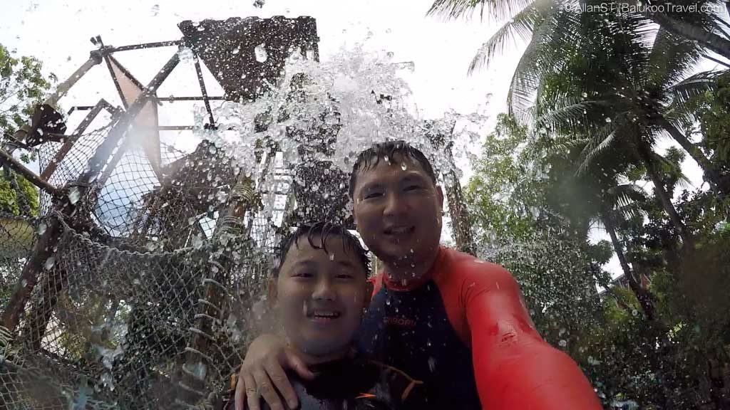Getting a splash at the Big Bucket Treehouse (Adventure Cove Waterpark)