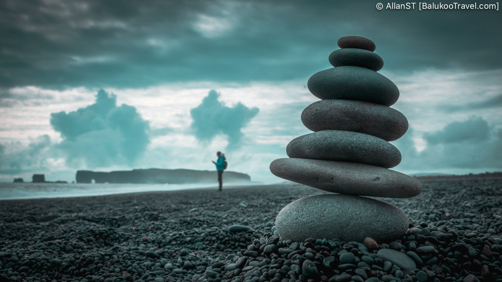 Reynisfjara Black Sand Beach. Known for its jet-black volcanic sand, hexagonal basalt columns, and dramatic coastal cliffs.