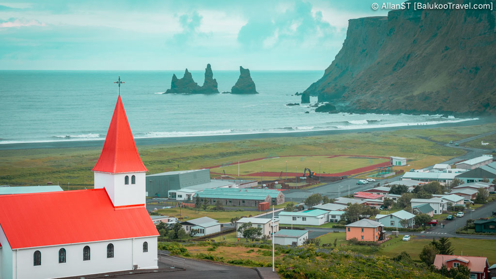 Vik i Myrdal Church. Overlooking the village of Vík and offering panoramic views of the coastline and offshore sea stacks.