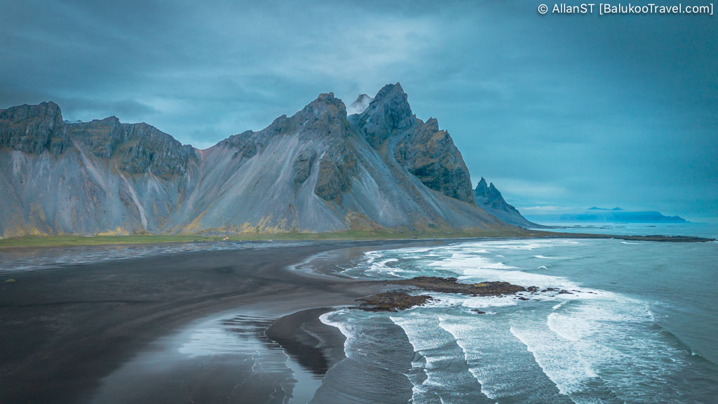 A black sand area dominated by the dramatic Vestrahorn mountain. Stokksnes
